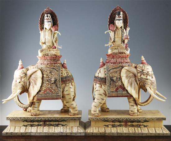 A pair of Oriental sectional bone groups of a Bodhisattva riding an elephant, 25in.